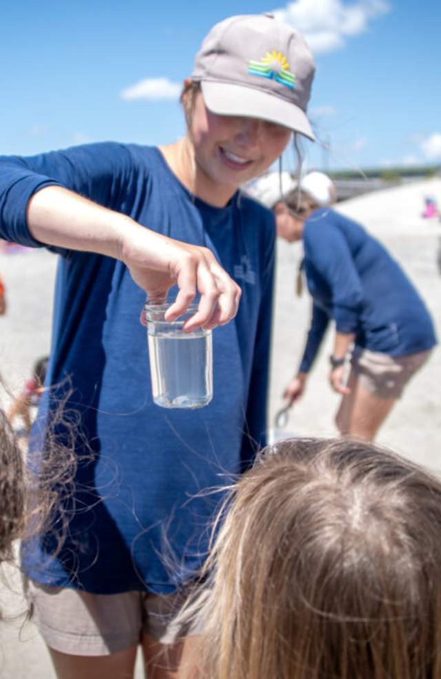 Park staff educating children on the ocean water.