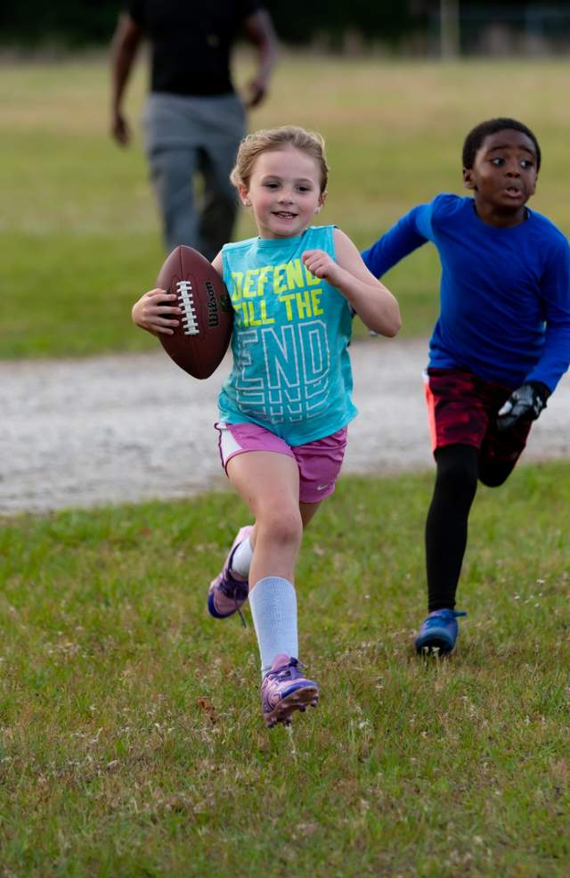Children playing football.