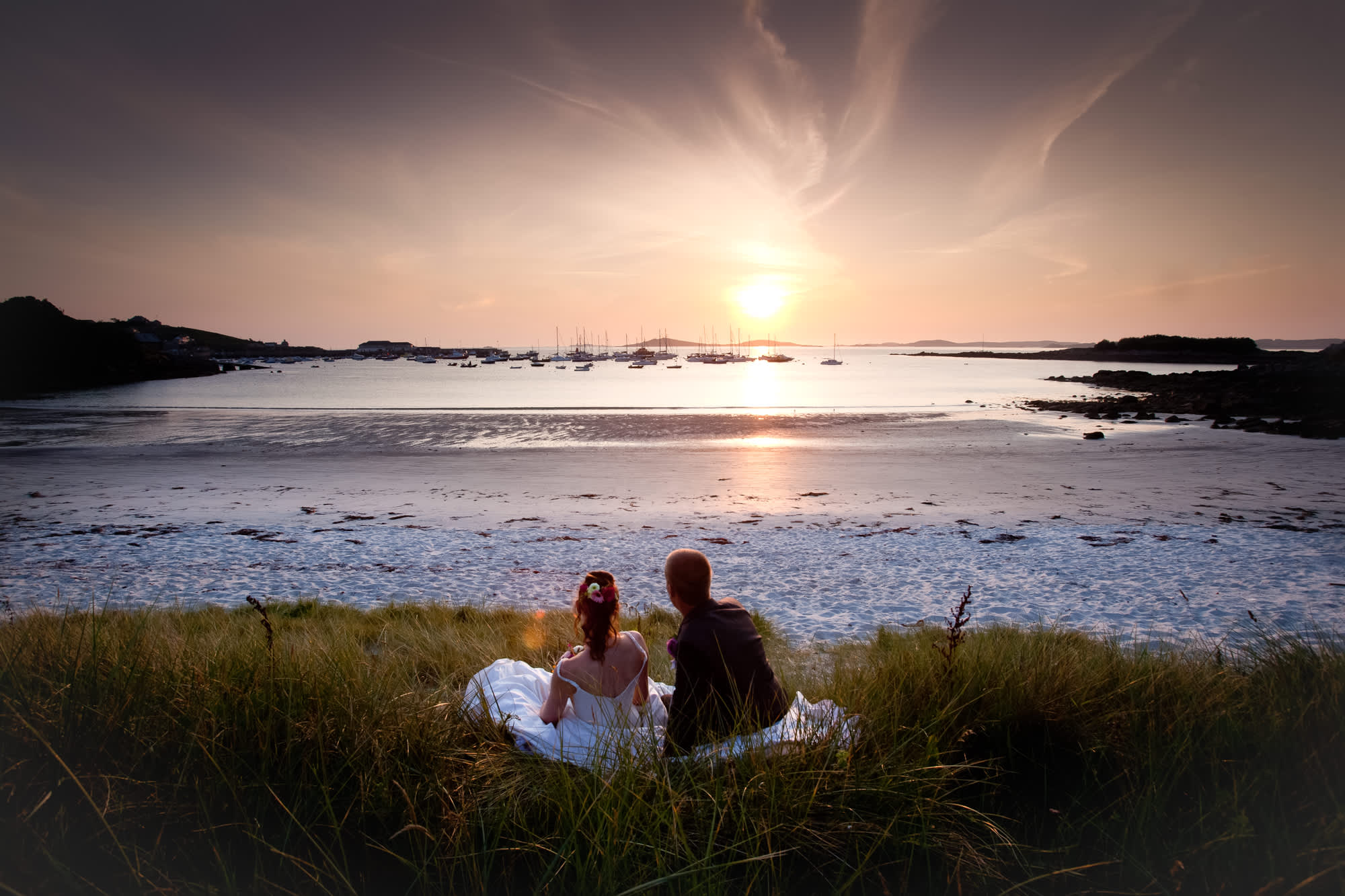 Wedding couple watching the sunset on St. Martin's