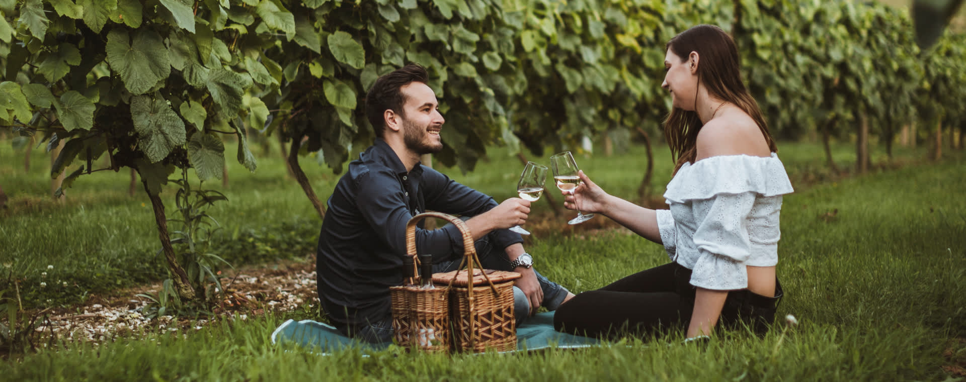 Couple having a picnic at Little Wold Vineyard in South Cave, East Yorkshire