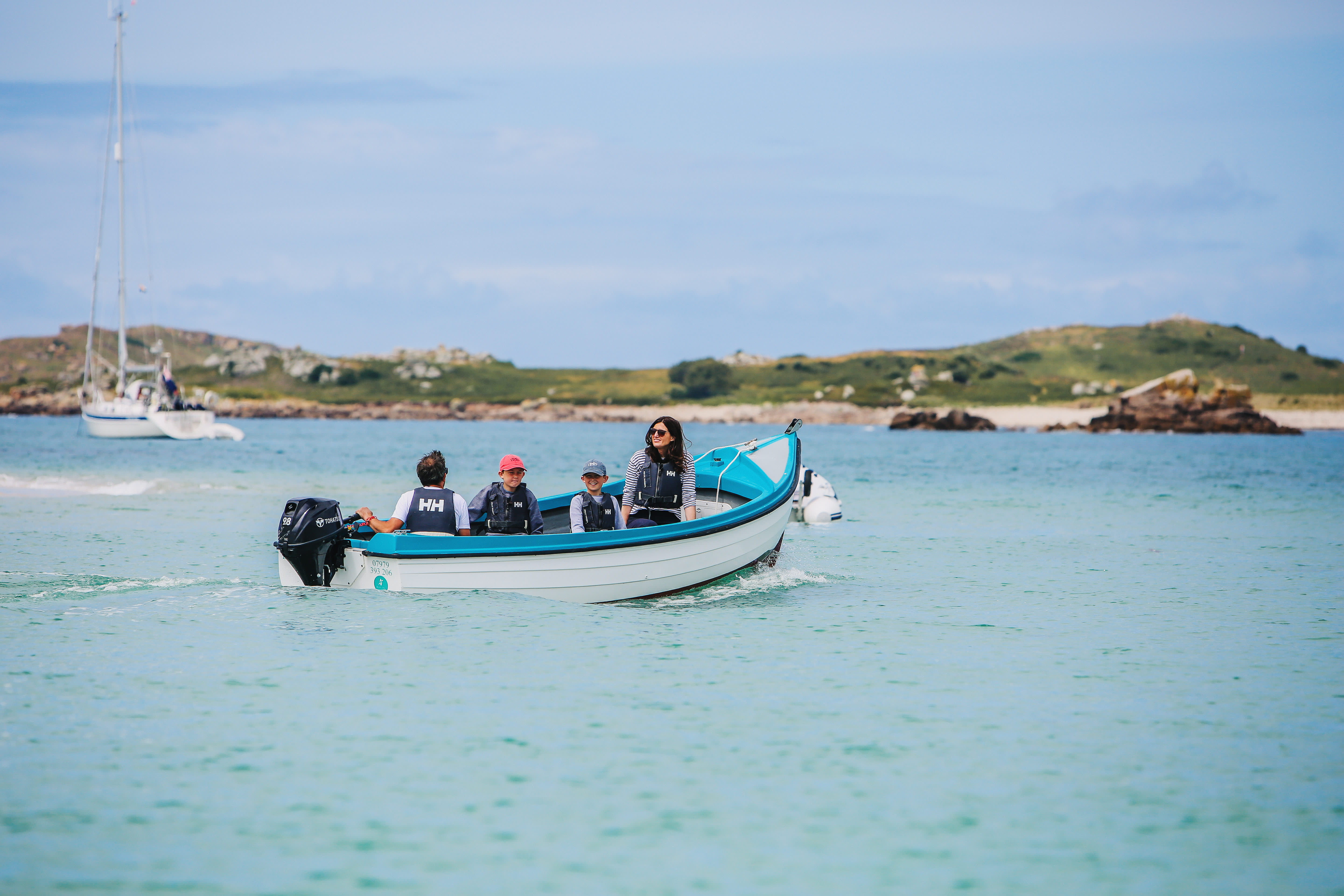 Family on a boat around Bryher