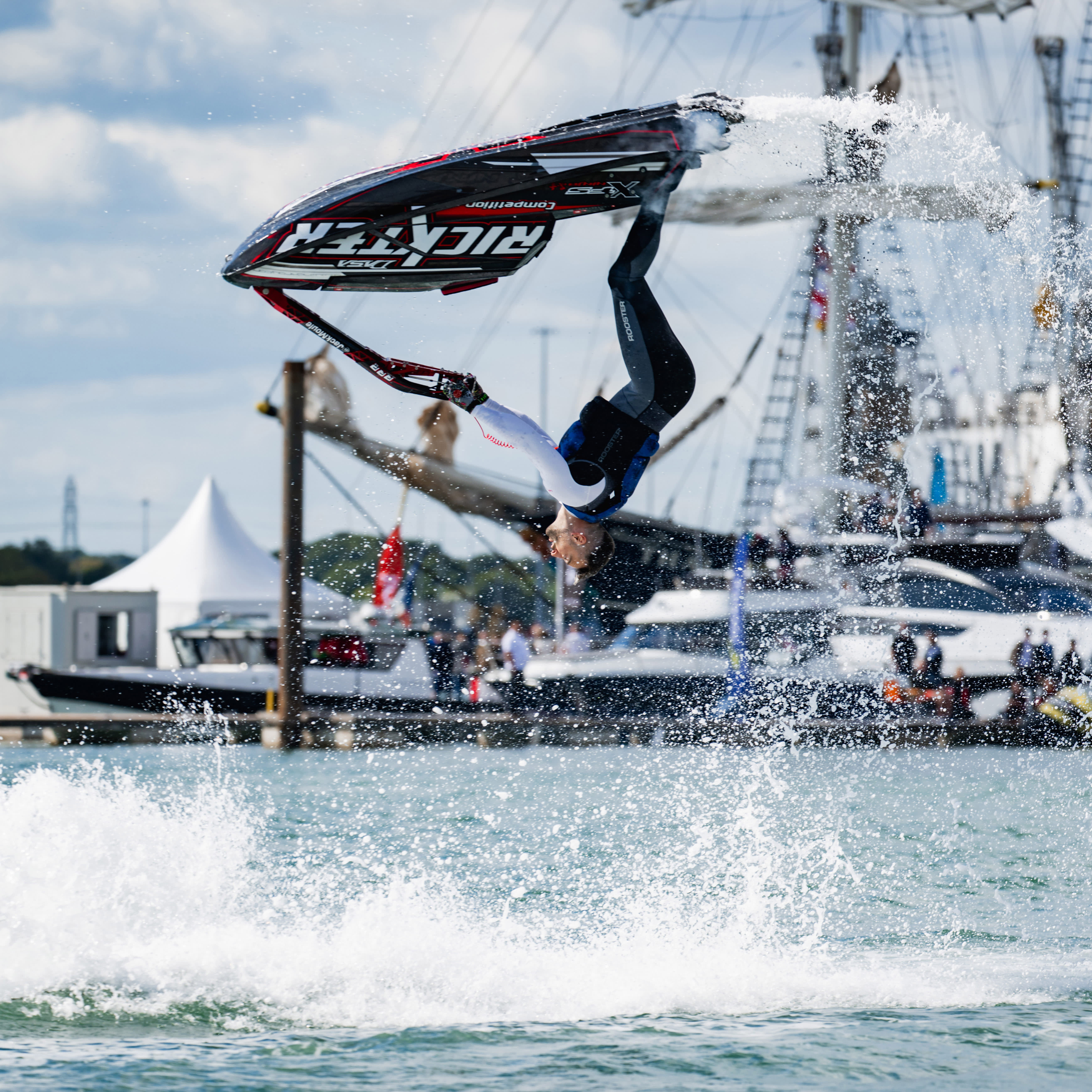 Man doing back flip on a jet ski at Southampton International Boat Show