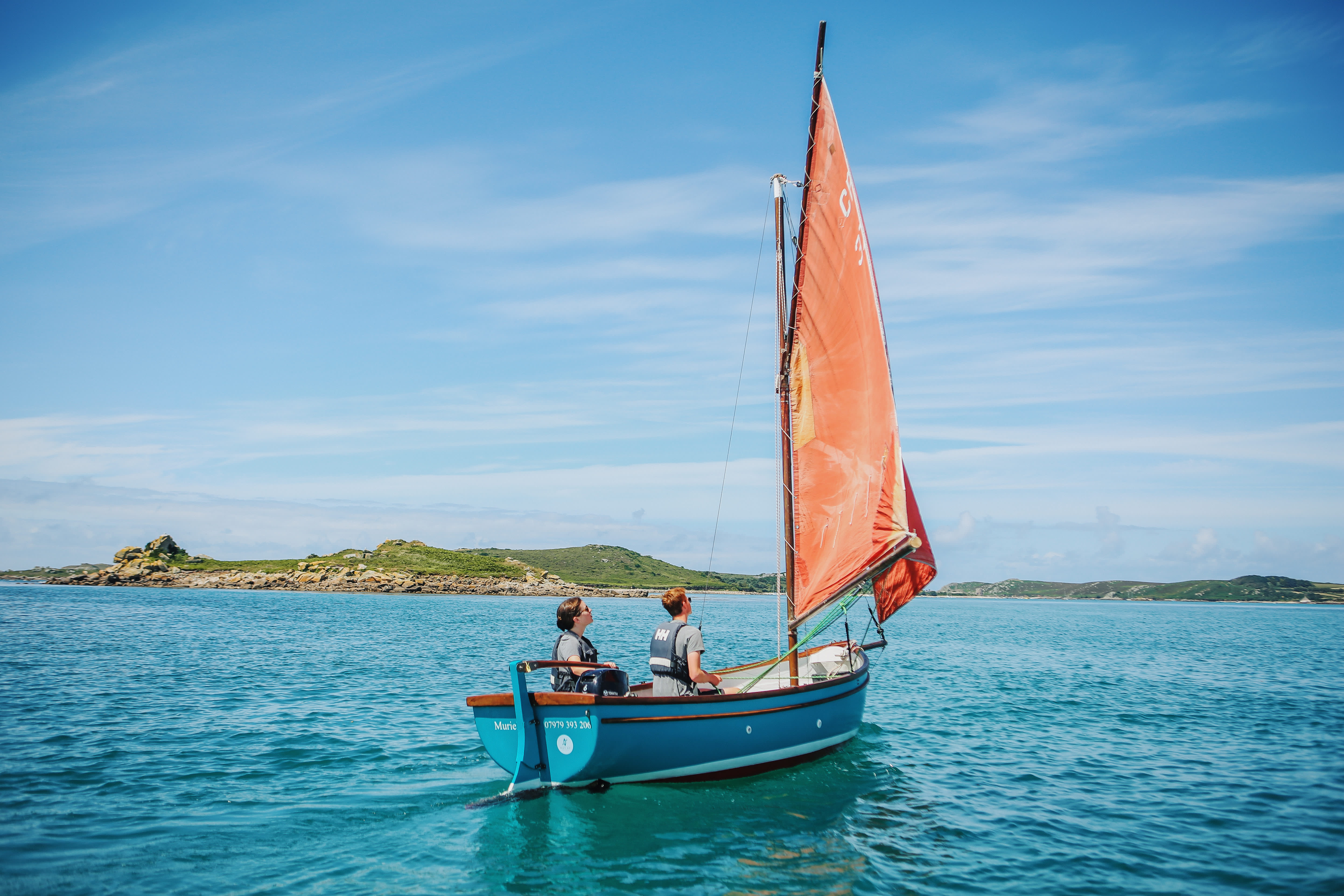 Family sailing around the islands