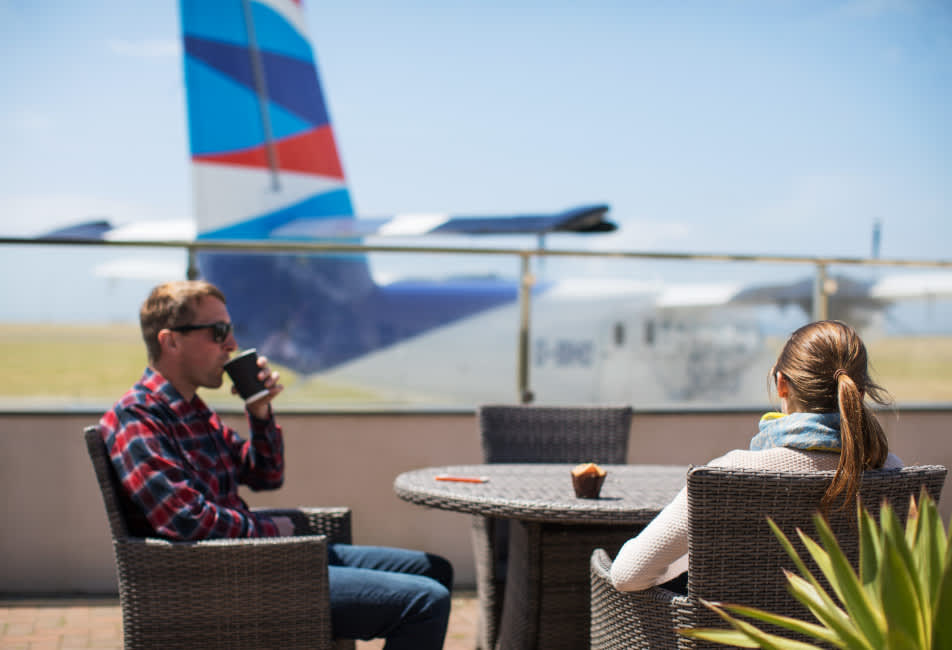 Couple waiting to board Skybus at Land's End Airport