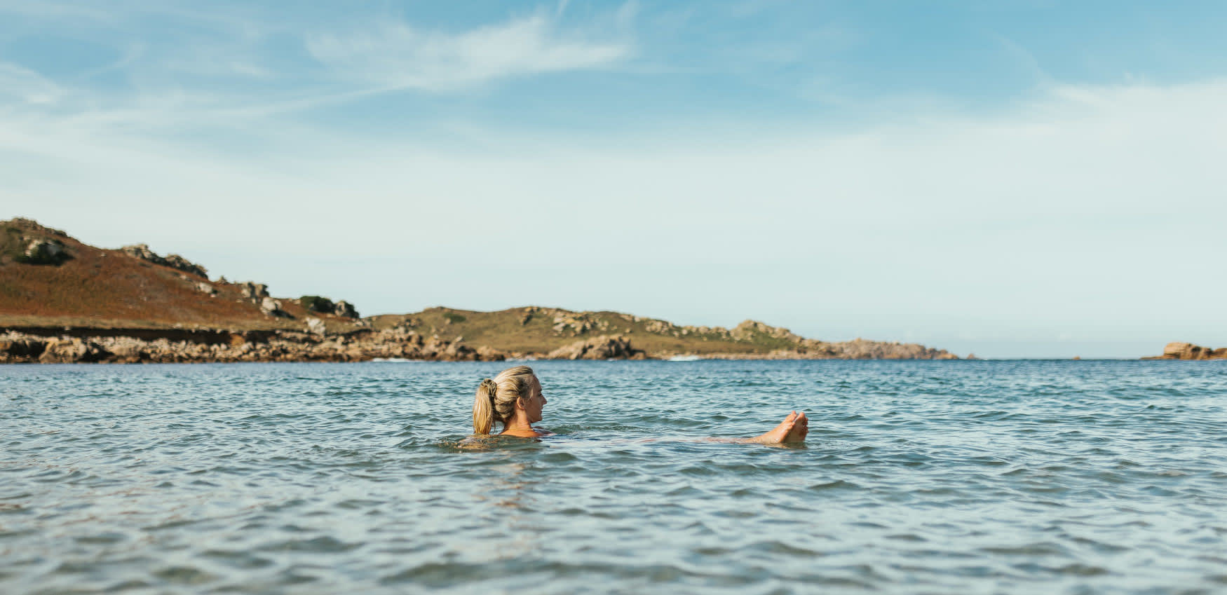 Woman swimming in Autumn