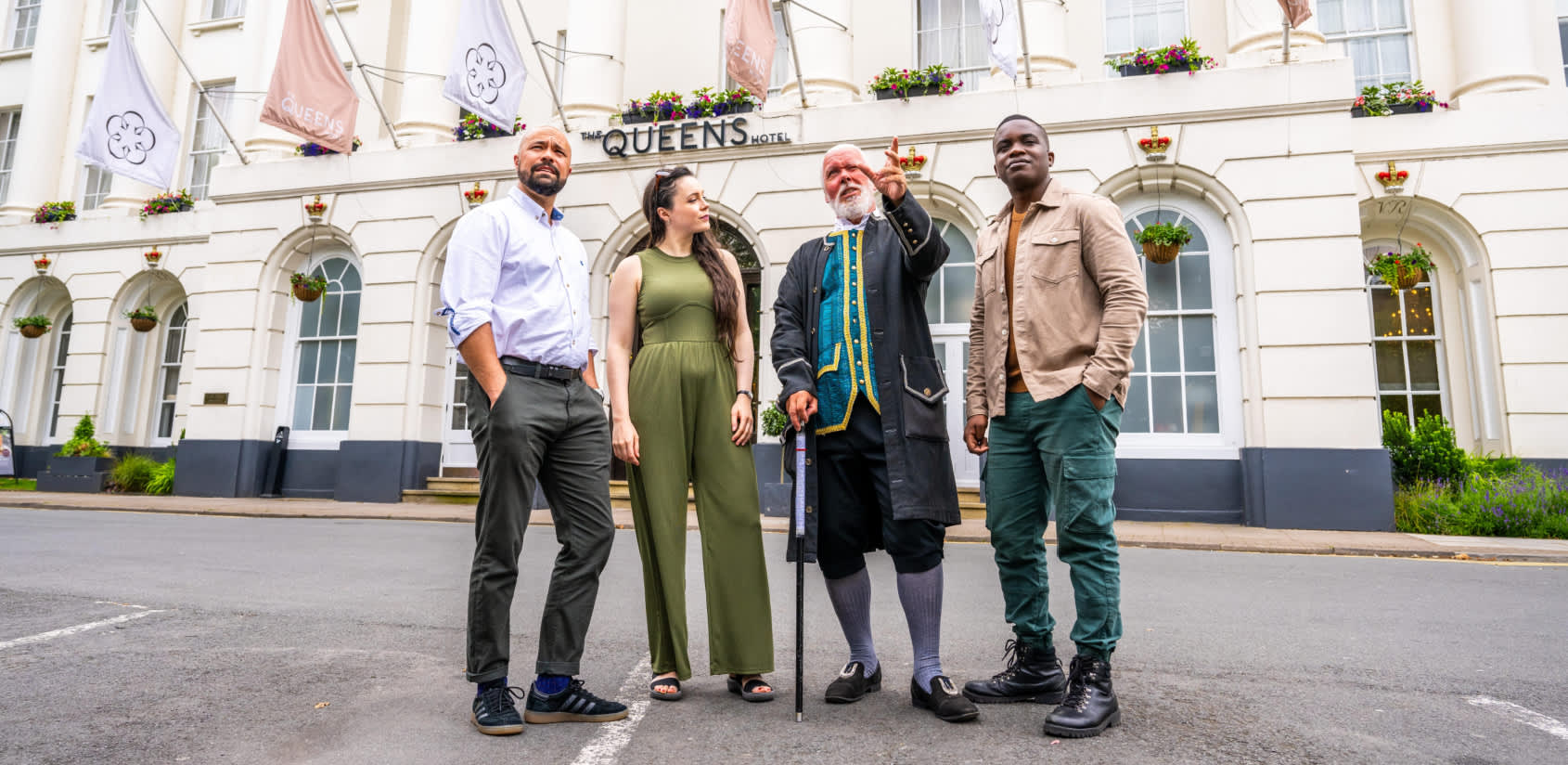 Group tour Cheltenham. Group stood outside the Queens Hotel Cheltenham with tour guide Phil from Cheltenham Promenaders.