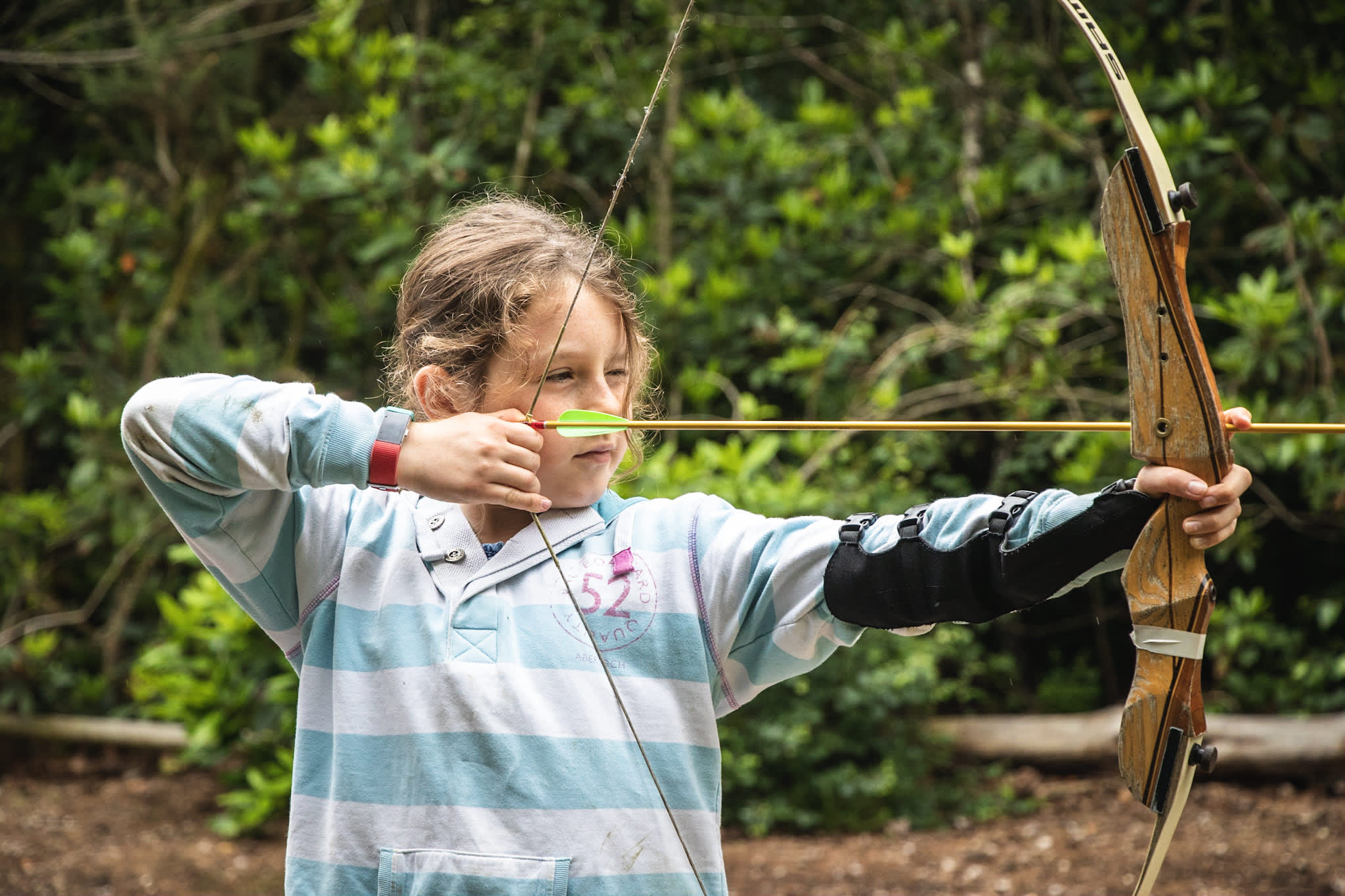 Girl doing archery at New Forest Activities - Activities Hero