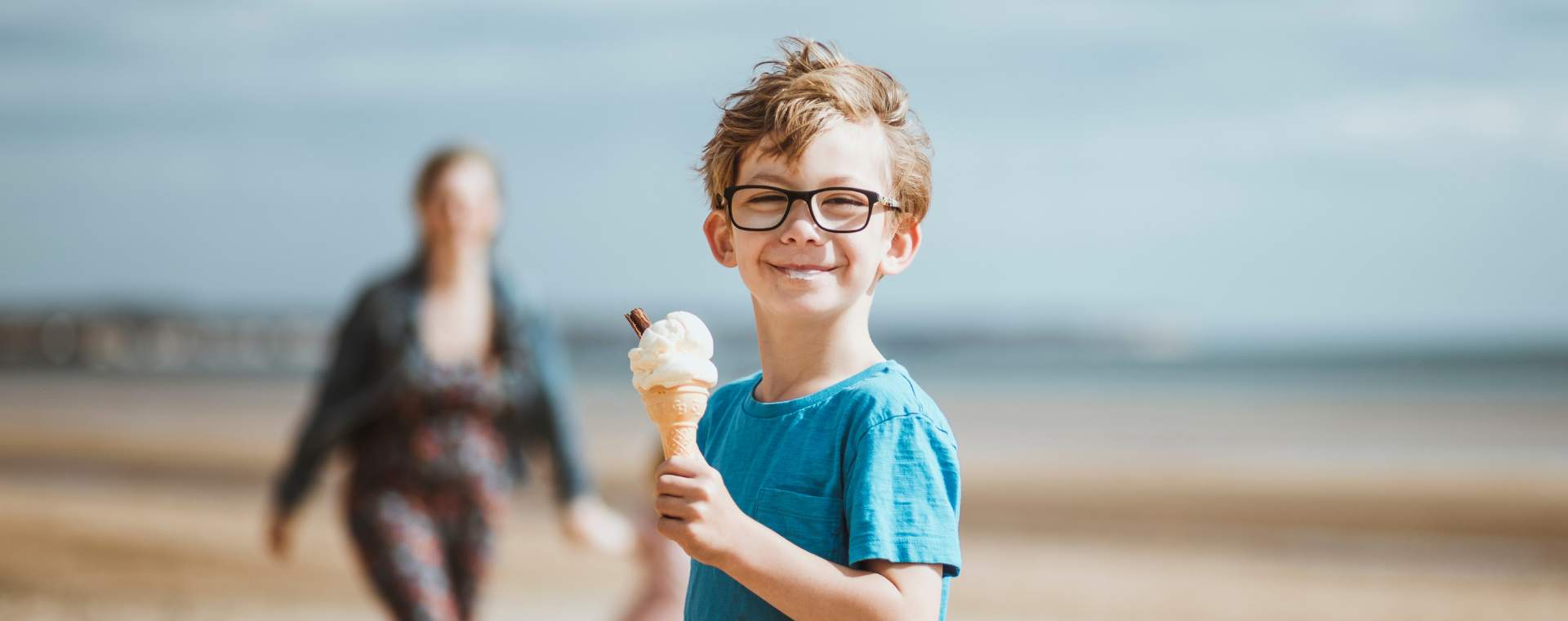 A young boy enjoying an ice cream on one of East Yorkshire's award winning beaches