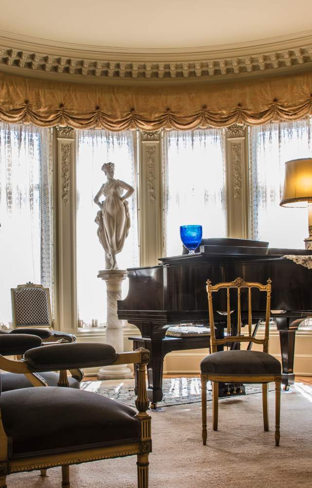 A photo of the music room inside the historic Oliver Mansion
