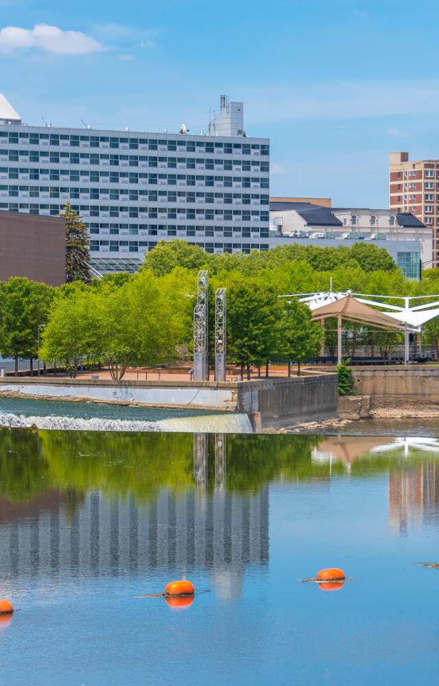 A photo of the river in front of the Century Center and DoubleTree by Hilton
