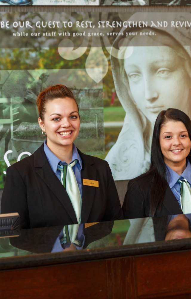 Front desk employees at the Inn at Saint Mary's