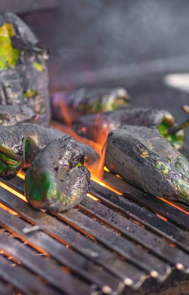 Poblano peppers on a fiery grill at Jesus Latin Grill & Tequila Bar