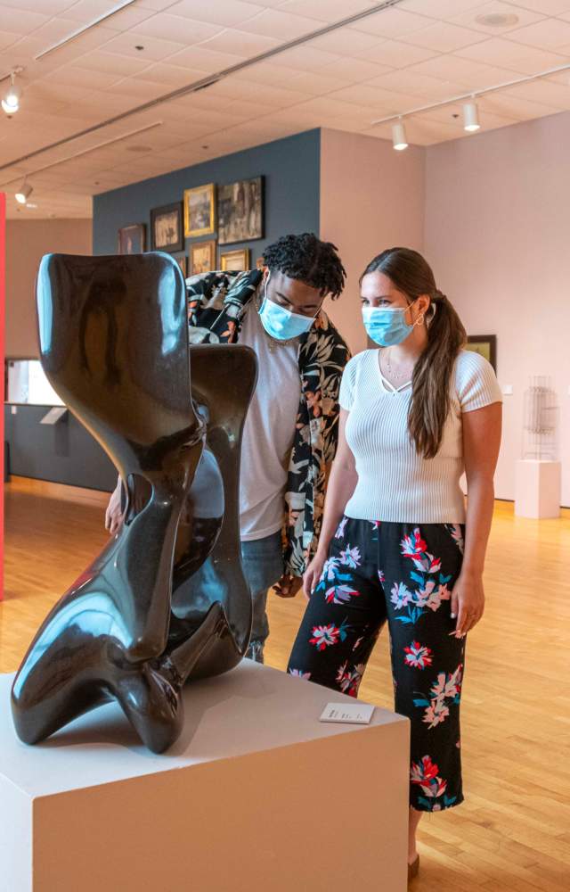 A masked couple enjoys artwork at the South Bend Museum of Art