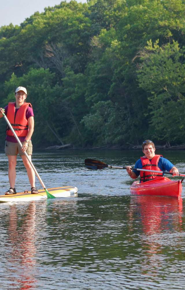 Visitors enjoy a kayak and paddle board at St. Patrick's County Park