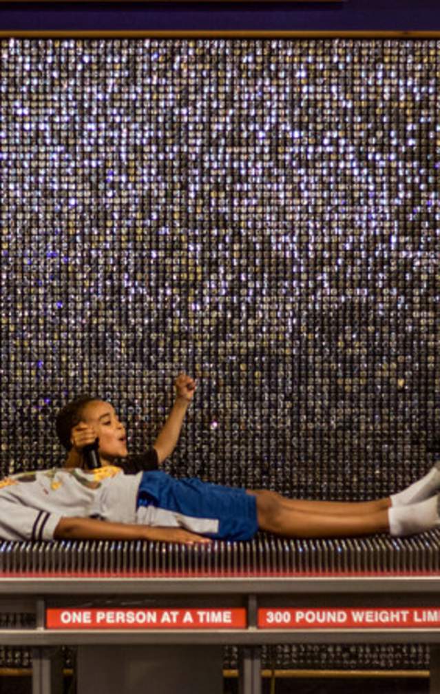 Two little boys exploring a bed of nails exhibit at WonderLab Museum