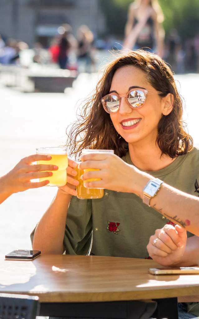 3 women cheering with drinks