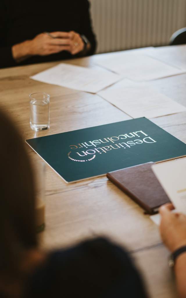 a table top image with a sign that reads 'Destination Lincolnshire'