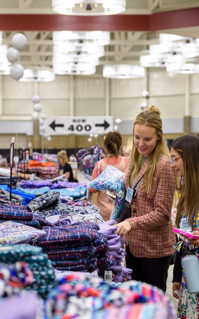 women shopping for handbags at the vera bradley annual outlet sale