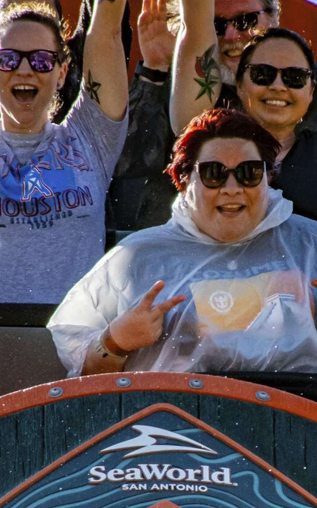 Rollercoaster riders laughing on ride