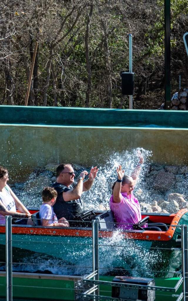 Family splashing down on water ride