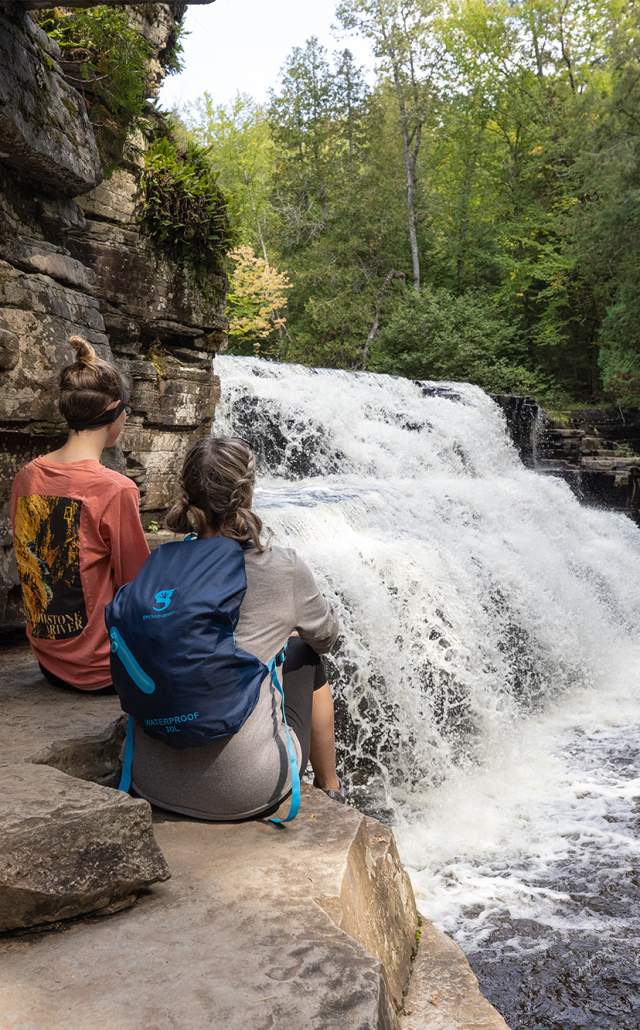Two women overlooking Canyon Falls, located in the Upper Peninsula of Michigan