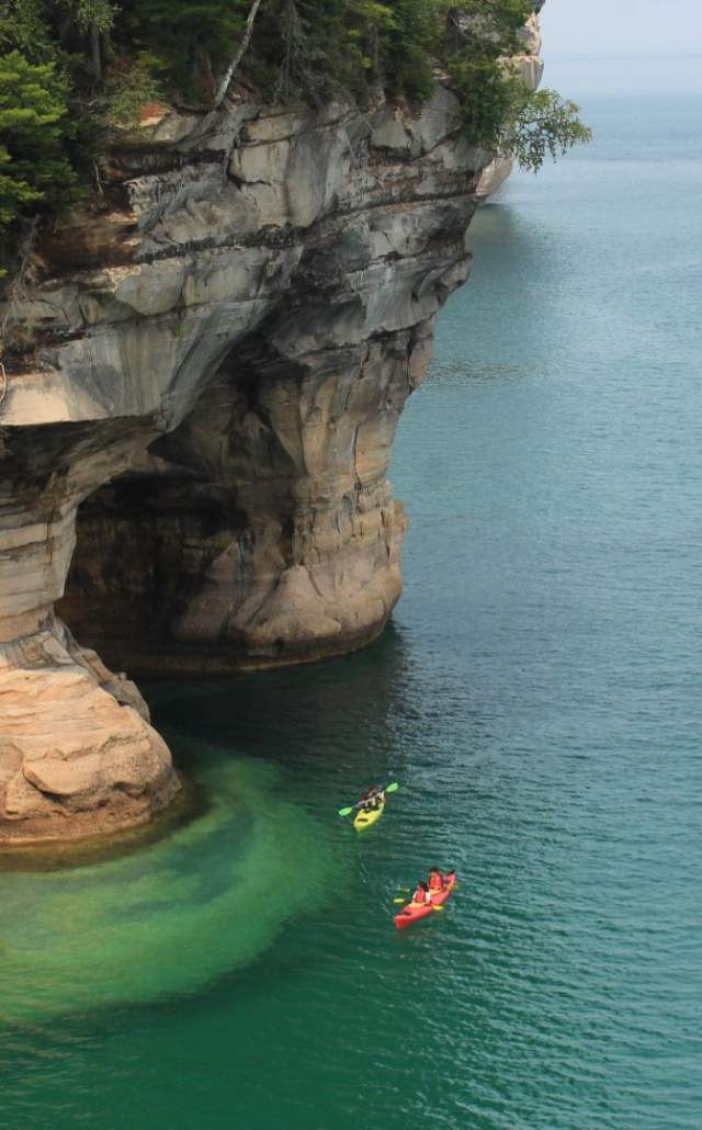 Kayaks in the water at Pictured Rocks National Lakeshore