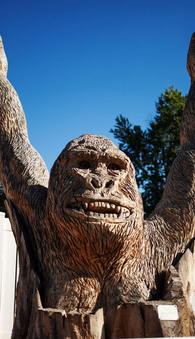 gorilla carved into tree stump with chainsaw