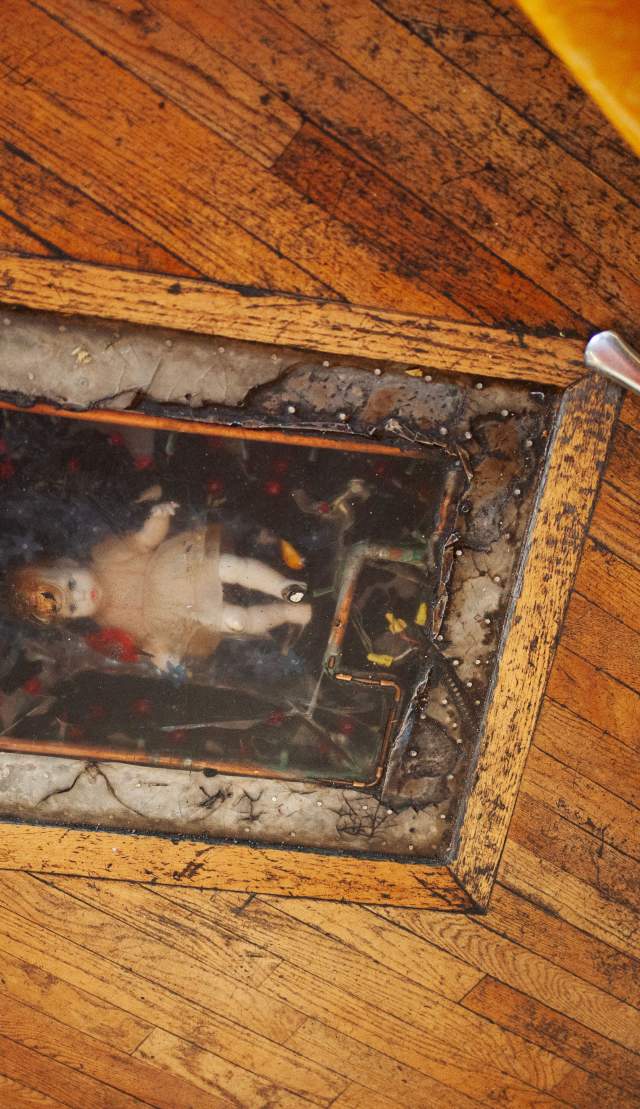 doll in the floor at margies