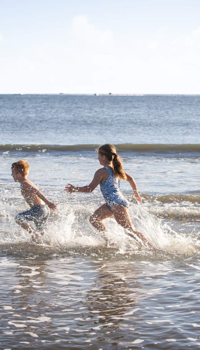 Children playing in the ocean