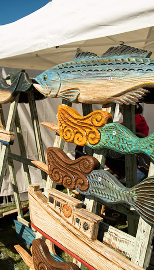 decorative wooden signs for sale at the vendor stalls at the nc oyster festival