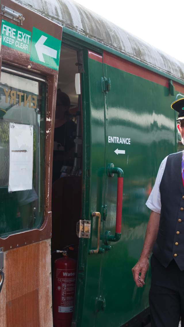Swanage Railway train and conductor at Swanage Station in Dorset