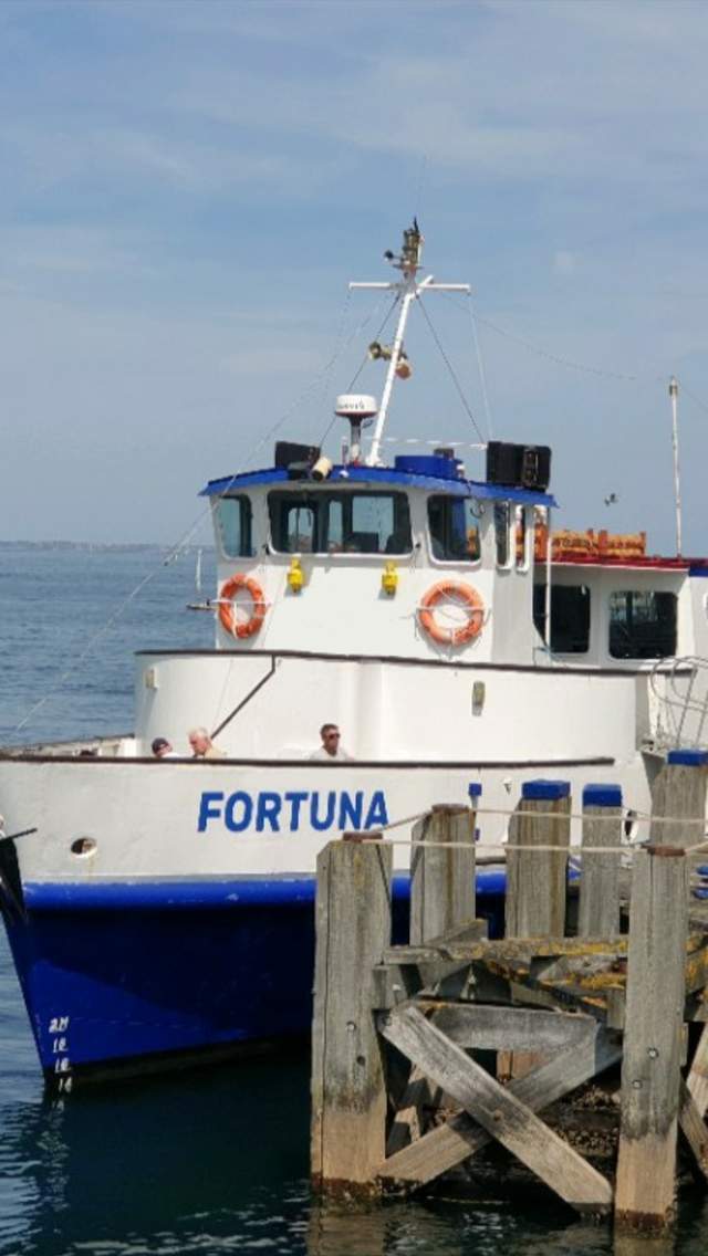 Coastal Cruises Poole Ltd's Fortuna boat at Swanage Pier in Dorset
