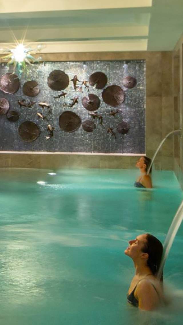 Two people in the Hydrotherapy Pool at Monart Spa, Poundbury in Dorset