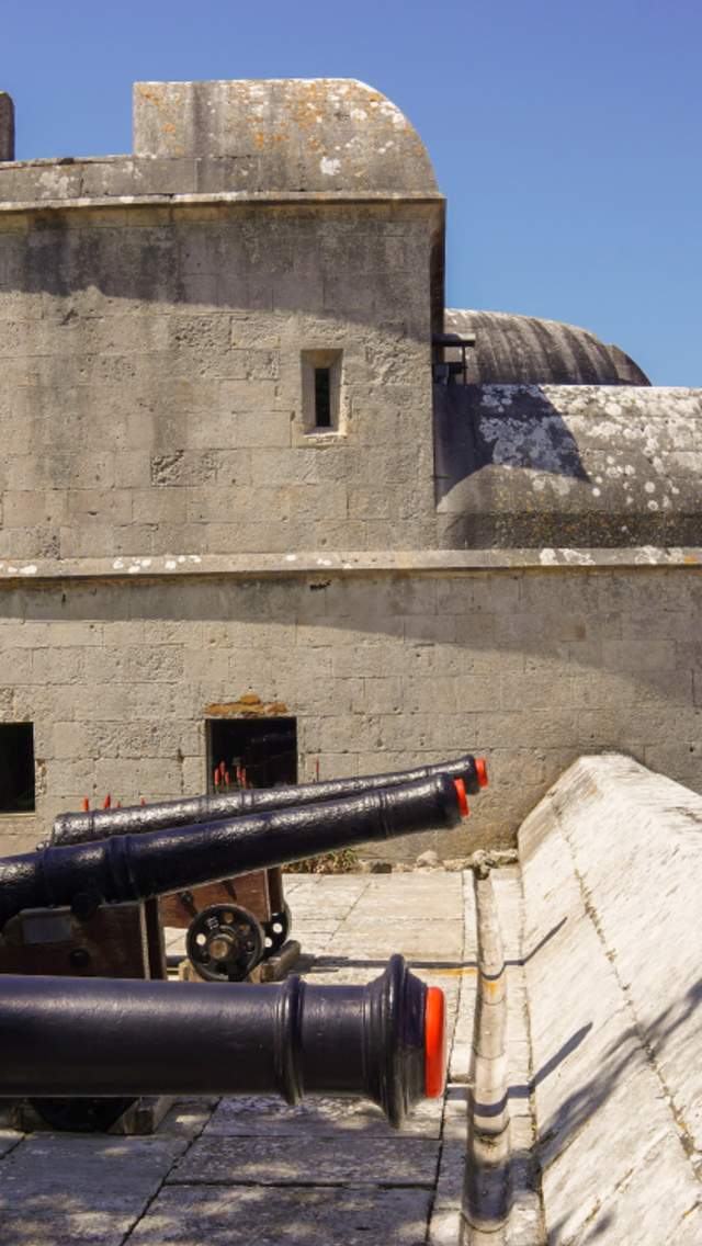 Exterior of Portland Castle in Dorset, with gun canons in the foreground