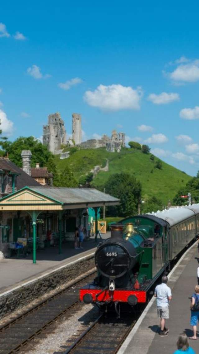 Swanage Railway steam train at Corfe Castle station in Dorset