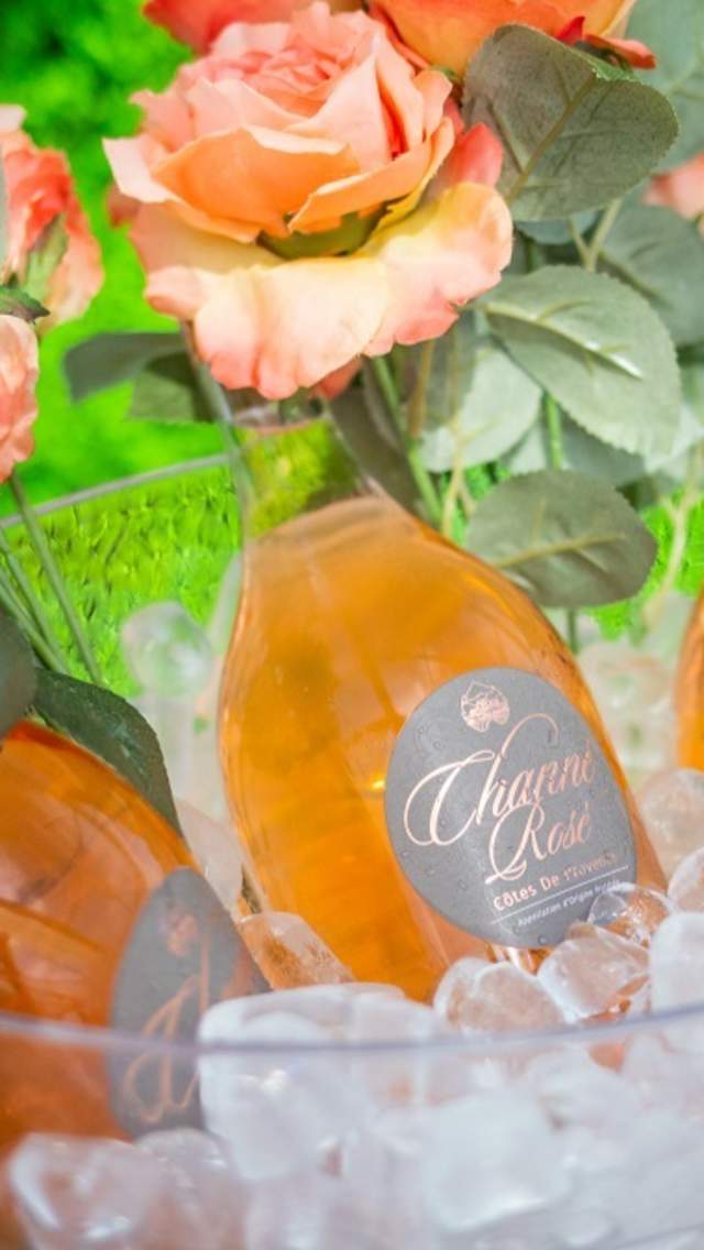 Three bottles of Rose Wine in a clear ice bucket