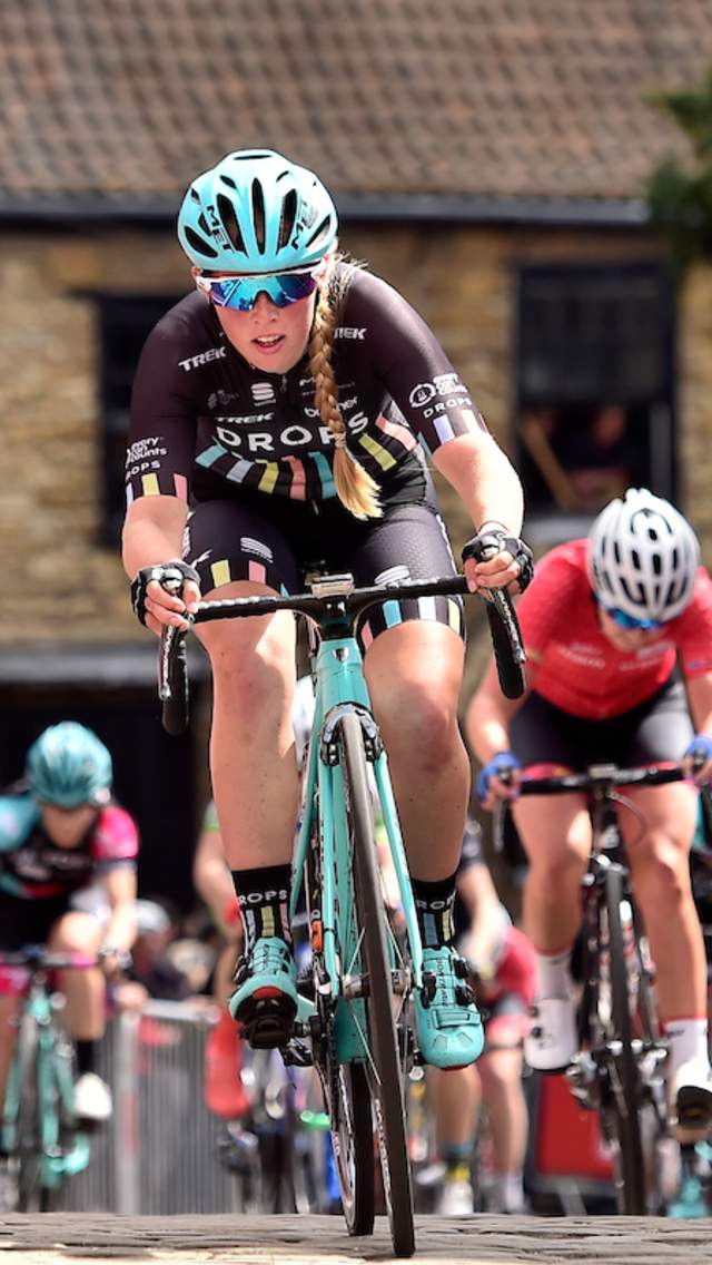 A woman cycling through the Cathedral Quarter, as part of the Lincoln Cycling Grand Prix