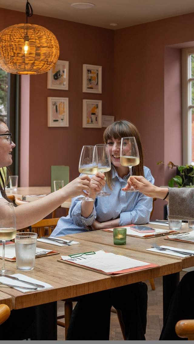 Three female friends enjoy dinner and drinks at the White Horse Lincoln