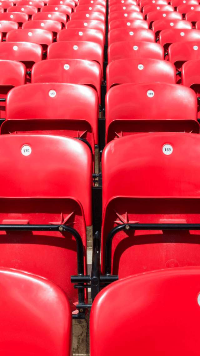 Empty red football stadium seats