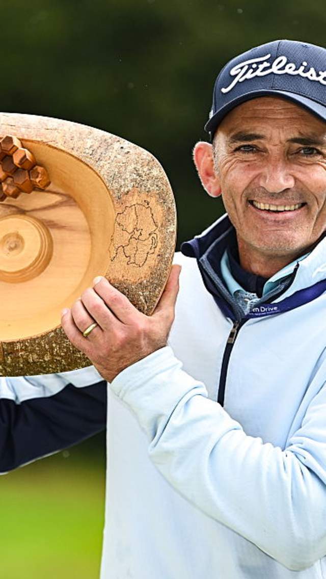Image of Marcus Brier with NI Legends Open trophy.