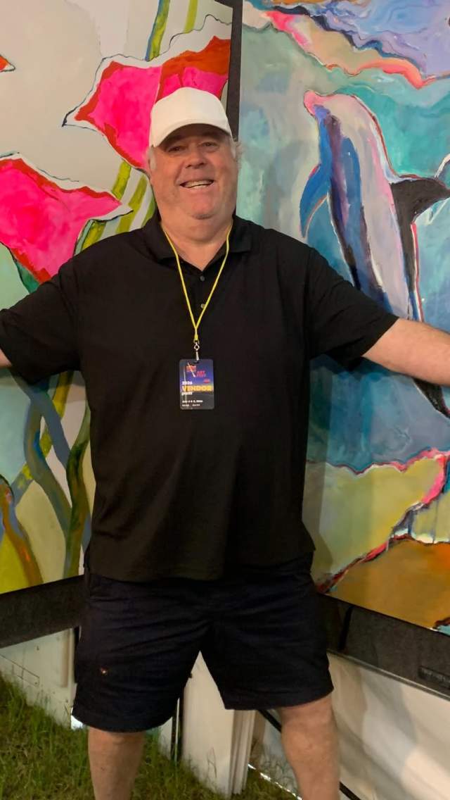 Man in Front of Painting at Art Festival