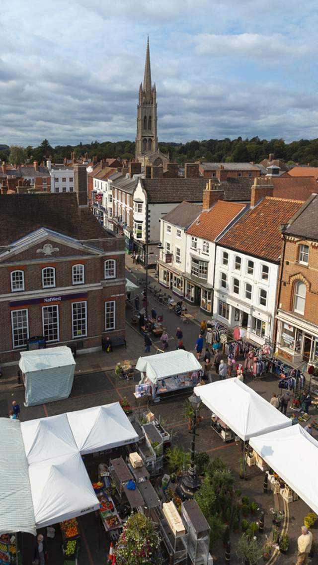 a market in Louth from above with church in background