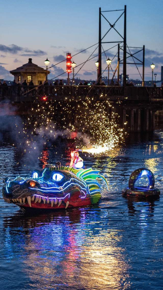 A light up large, puppet on the water