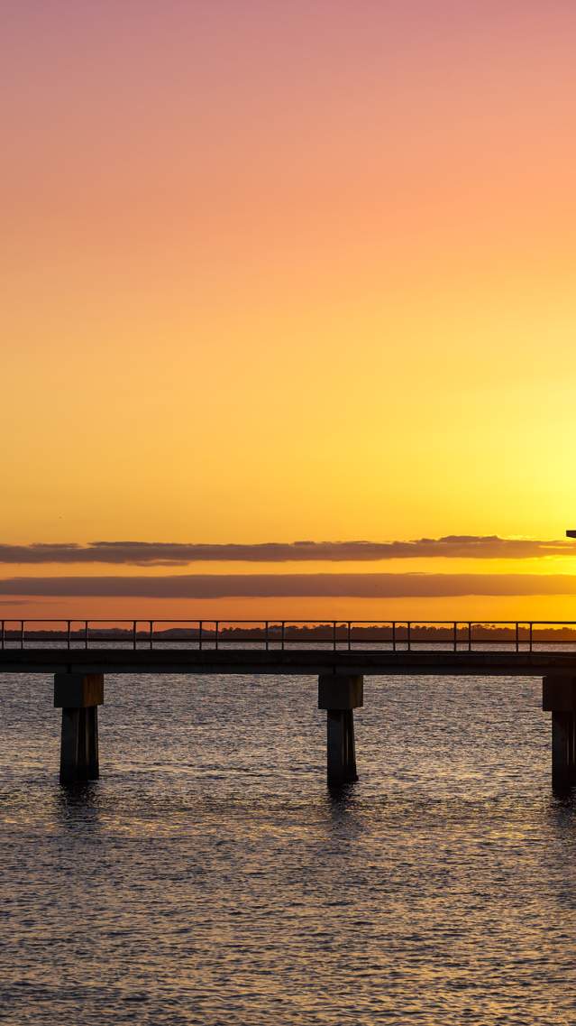 The Jekyll Island Fishing Pier provides ample opportunities for fishing, sunset watching, and sightseeing on Jekyll Island, GA.