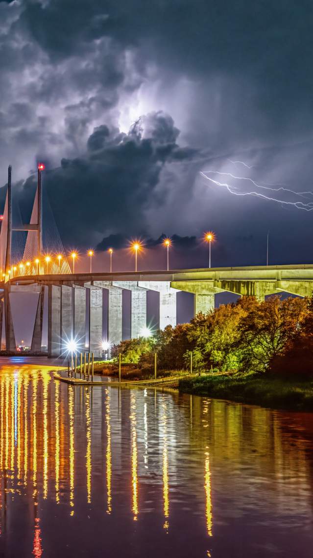 A lightning storm above Brunswick's Sidney Lanier Bridge lights up the night sky.