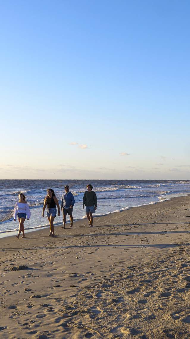 Family Walking on the Beach