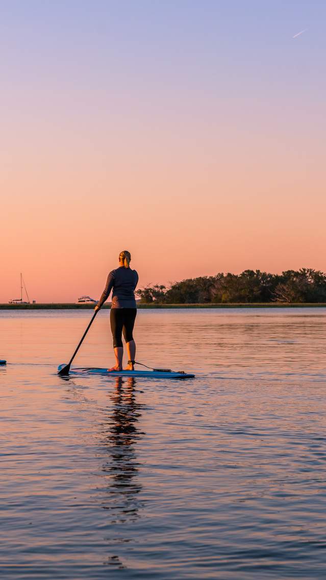 A group of friends enjoys the water on paddleboards in Golden Isles, Georgia