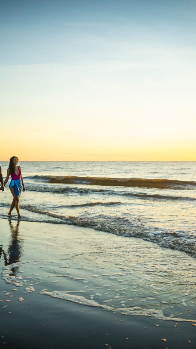 Couple walking on East Beach