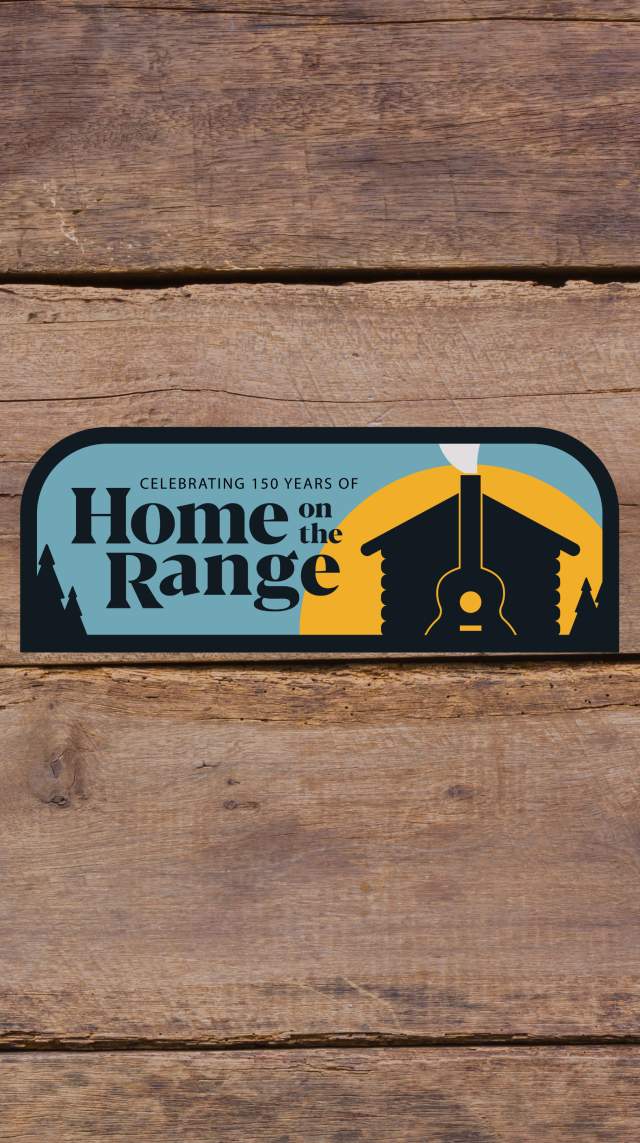 Blue and gold home range patch with a silhouette of a cabin in front of a sunset