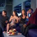 Fans cheering in a premium hospitality suite